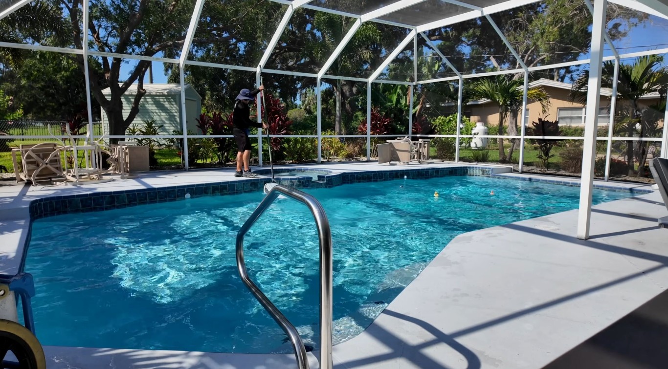 Well-maintained pool equipment in screen-enclosed pool